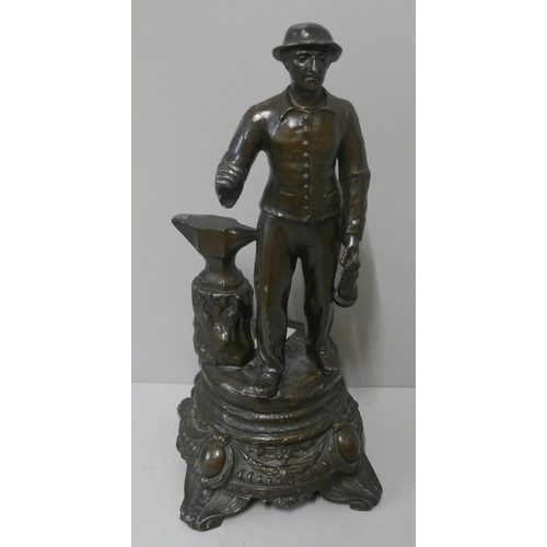 292A - A spelter figure of a miner