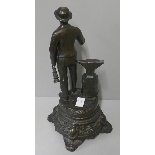 292A - A spelter figure of a miner