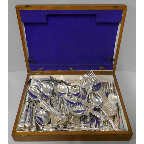 297 - A collection of flatware in a cutlery canteen, a pewter teapot and a tray