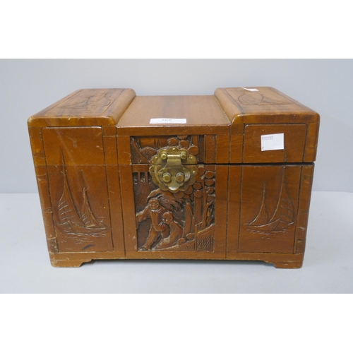 298 - A miniature oriental carved camphorwood blanket box