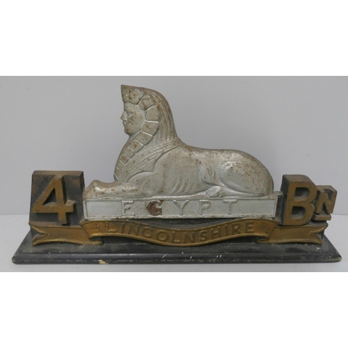 316 - A regimental Sphinx doorstop, 4th Btn, Linlcolnshire Regiment