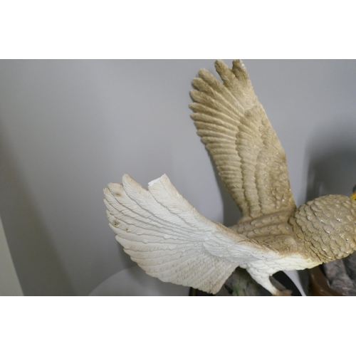 325 - Two large models of birds, Tang's Art Design Co. Peregrine Falcon and a Leonardo Collection barn owl... 