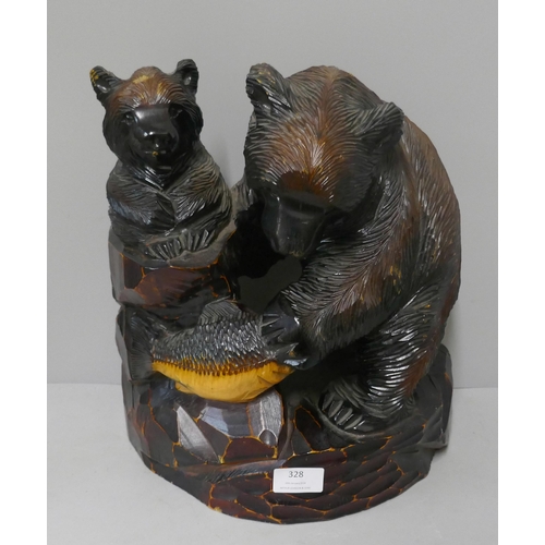 328 - A Japanese carved softwood figure of bears