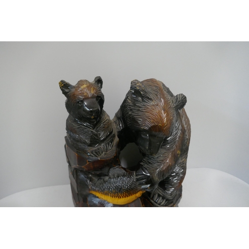 328 - A Japanese carved softwood figure of bears