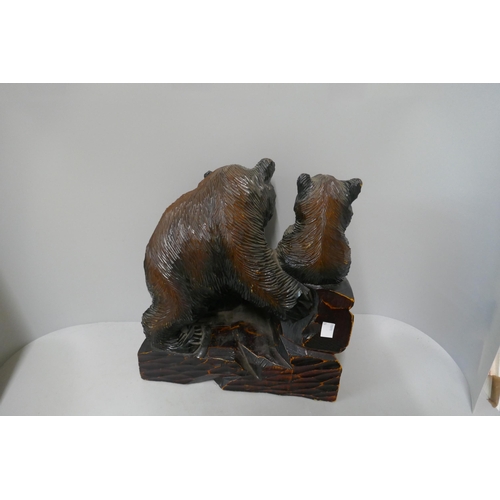 328 - A Japanese carved softwood figure of bears