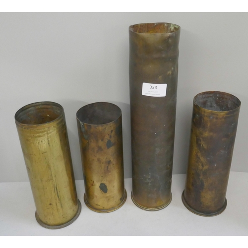 333 - Four military artillery shell cases