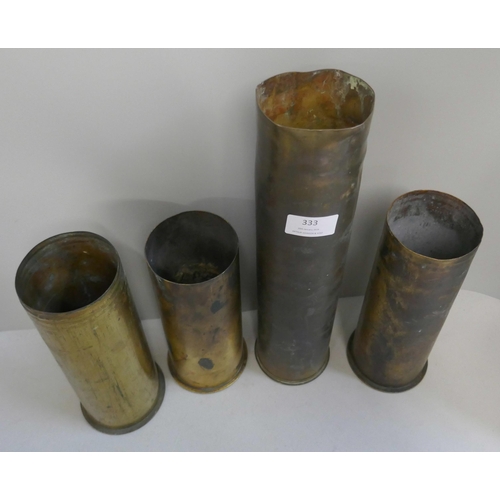 333 - Four military artillery shell cases