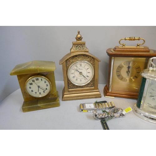 336 - Six clocks including one onyx, four carriage clocks, and two wristwatches by Quernex