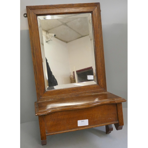 341 - An Edward VII walnut wall hanging mirror