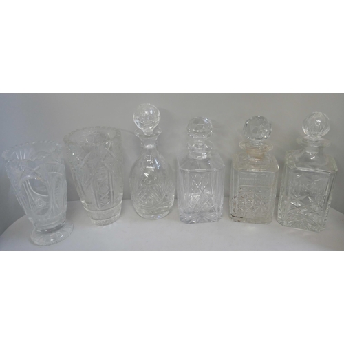 343 - A collection of crystal cut glassware, including decanters and vases