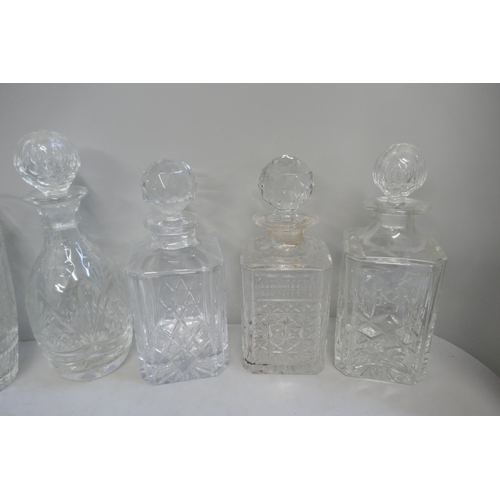 343 - A collection of crystal cut glassware, including decanters and vases