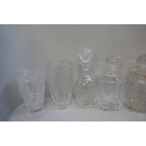 343 - A collection of crystal cut glassware, including decanters and vases