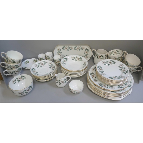 354 - A Crown Staffordshire tea and dinner service, six/seven setting, 49 pieces