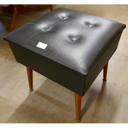 38 - A teak and black vinyl lady's sewing box