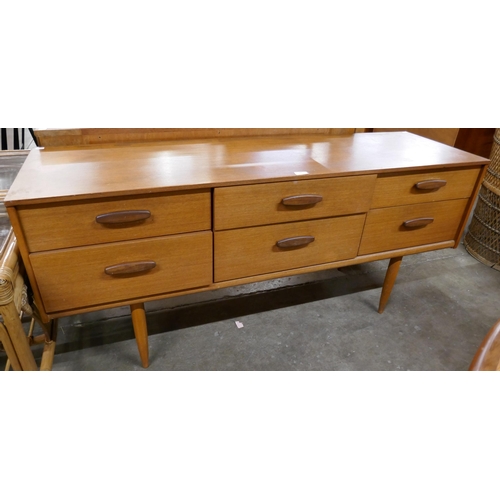 52 - An Austin Suite teak six drawer sideboard
