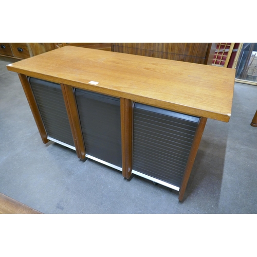 61 - A teak tambour fronted office cabinet