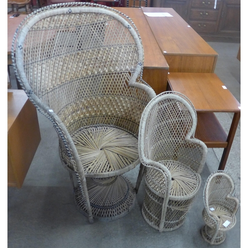 79 - A set of three Italian graduated wicker peacock chairs