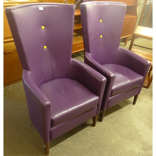 81 - A pair of beech and purple leather highback armchairs