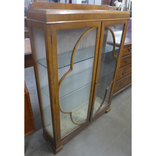 82 - An Art Deco walnut display cabinet