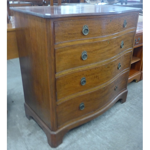 90 - A George III style mahogany serpentine chest of drawers