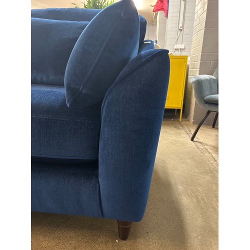 1418 - A blue velvet two seater sofa, RRP £1772