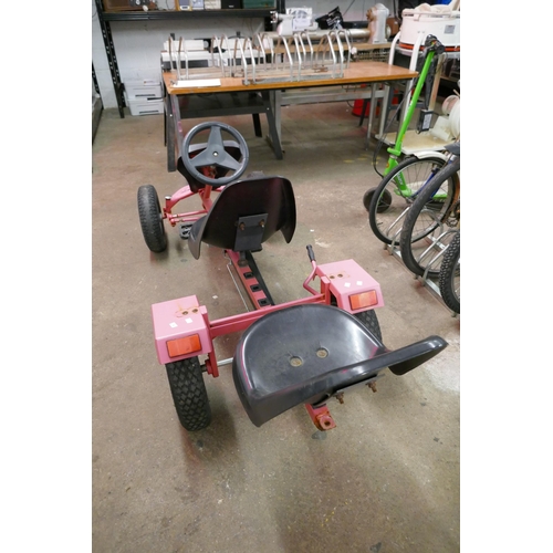 2199 - A red and black two seater tandem pedal Go-Kart