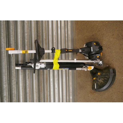 2215 - A petrol driven Titan TT5MTP26-2 multi tool with multiple attachments including hedge cutter, chains... 