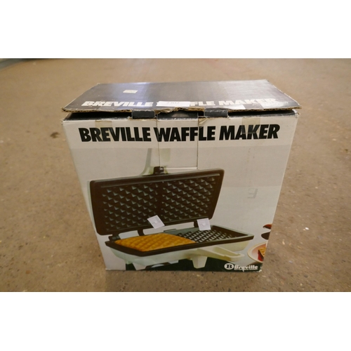 2302 - A Juice extractor and a Breville waffle maker