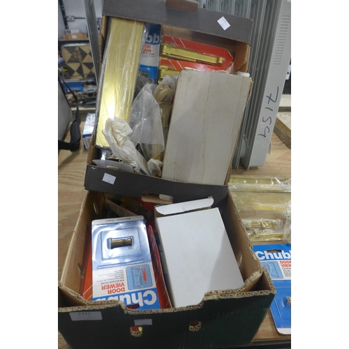 2322 - Two boxes of assorted ironmongery, mostly brass door fittings