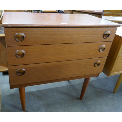 77 - A teak chest of drawers