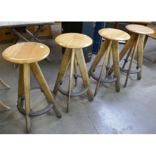 111A - A set of four elm and cast iron bar stools