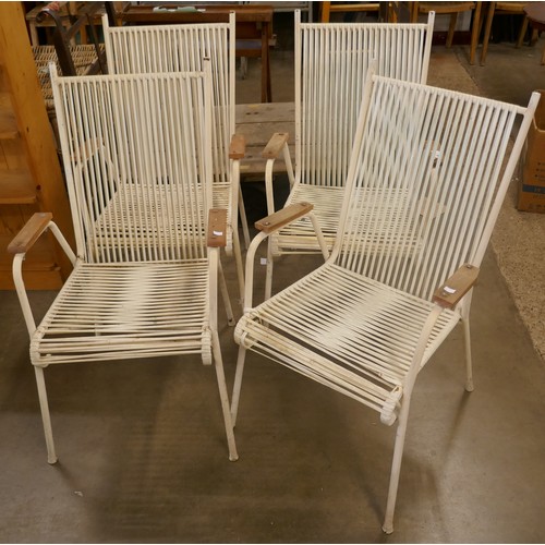 240A - A set of four white tubular steel framed garden chairs