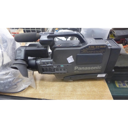 2066 - A Panasonic M54 video camera with tapes, tripod stand and roller