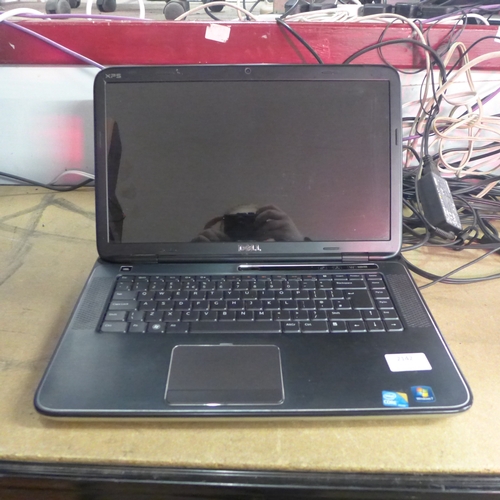 2142 - A Dell laptop with charger