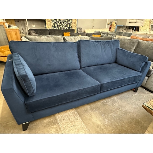 1530 - A Rene midnight blue velvet upholstered four seater sofa, RRP £1625