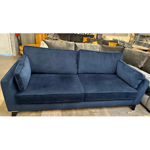 1530 - A Rene midnight blue velvet upholstered four seater sofa, RRP £1625