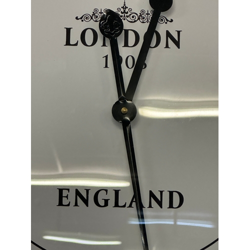 1618 - A large silver wall clock