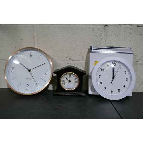 3012 - Three assorted clocks; wall and mantel * this lot is subject to VAT