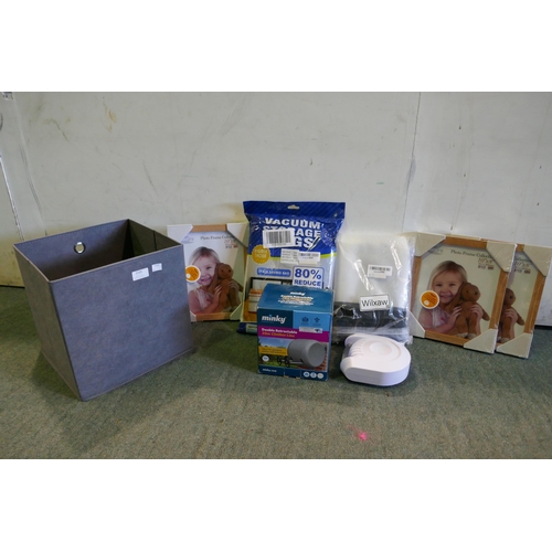 3105 - Fabric storage box containing assorted household items inc Vacuum Bags, Picture frames, Etc. * This ... 