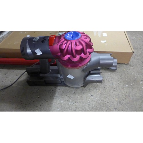 2103 - A Dyson V7 vacuum cleaner with charger