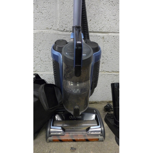 2174 - A Shark upright cordless vac - model K2160UK26, 28.8v with charger and accessories and a hand held S... 