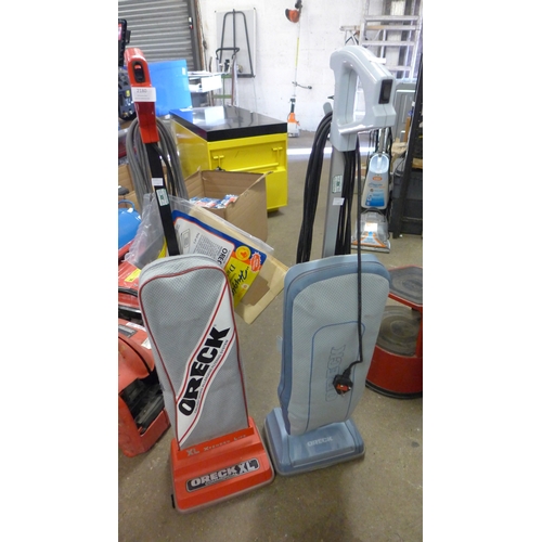 2180 - 2 Oreck vacuum cleaners, commercial XL and Oreck 3 upright