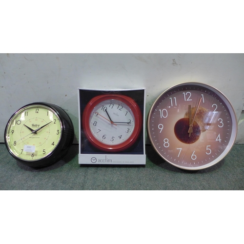 3397 - Three wall clocks (one damaged) *This lot is subject to vat