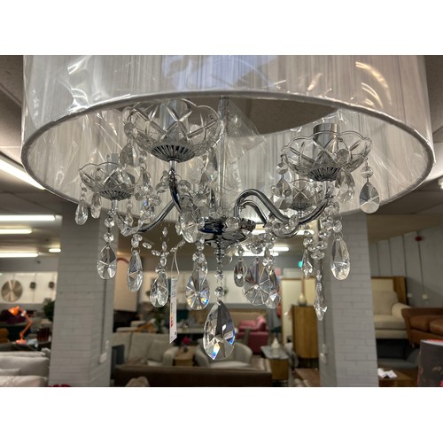 1500 - A chrome five arm chandelier with white shade