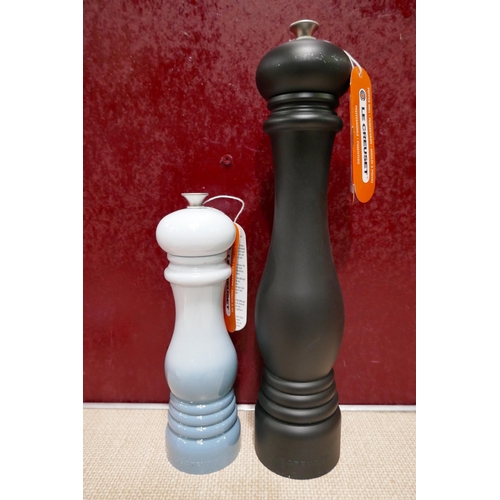 3185 - Le Creuset matte black pepper mill and coastal blue salt mill  * This lot is subject to vat