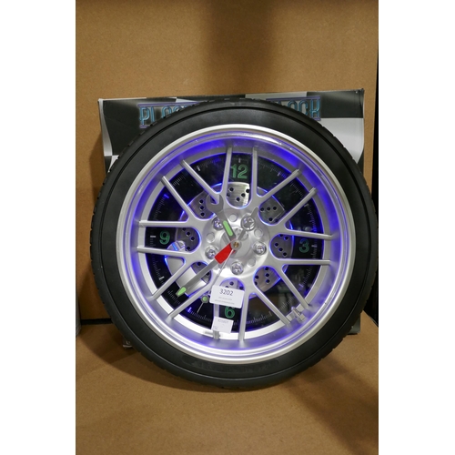 3202 - Neon lit - Novelty tyre - wall clock  * This lot is subject to vat