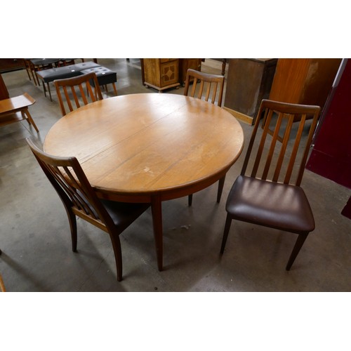 6 - A G-Plan Fresco teak circular extending dining table and four chairs