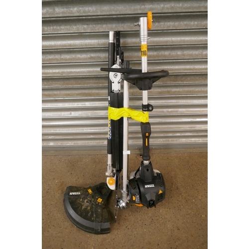 2215 - A petrol driven Titan TT5MTP26-2 multi tool with multiple attachments including hedge cutter, chains... 