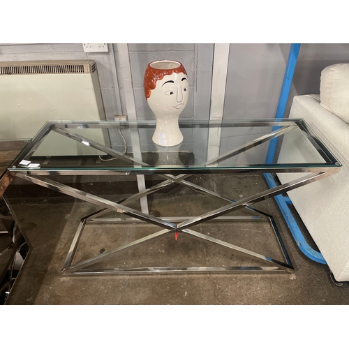 1383 - A glass and chrome 'X' base console table * this lot is subject to VAT