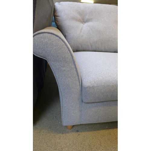 1398 - A grey upholstered three seater sofa